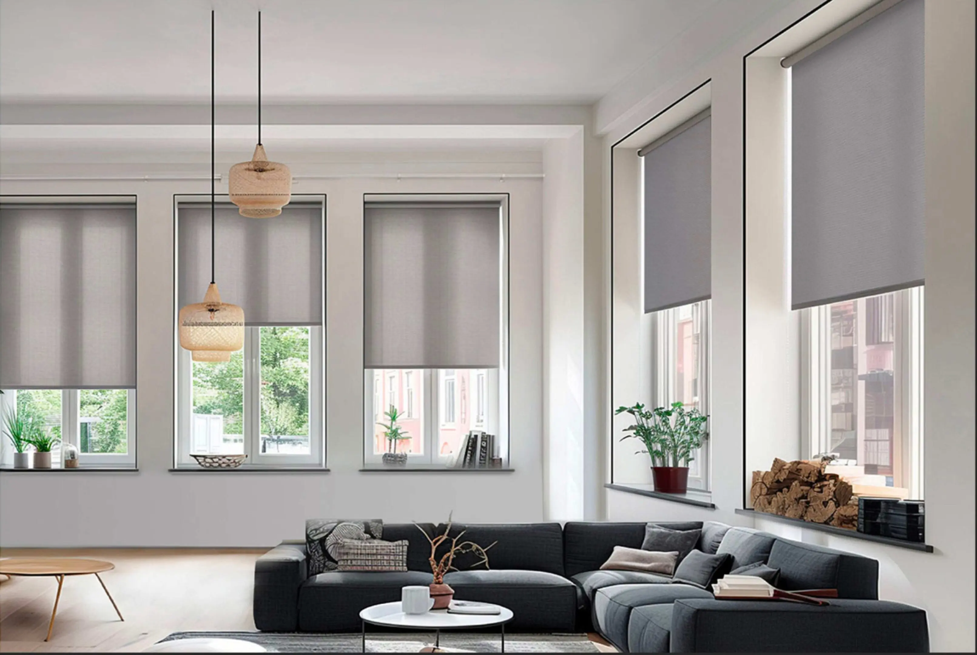 Modern living room with gray roller blinds and cozy seating.