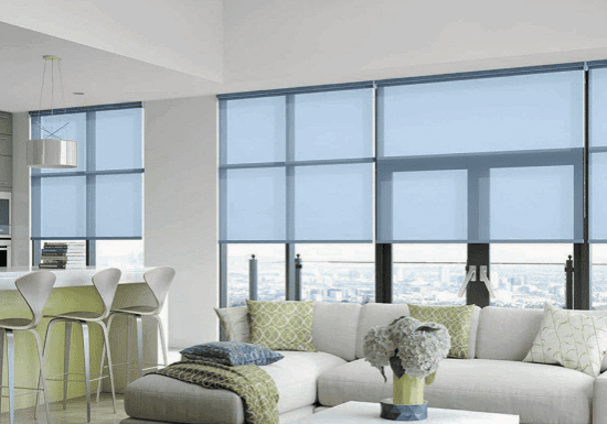 Modern living room with blue roller blinds and cozy seating.